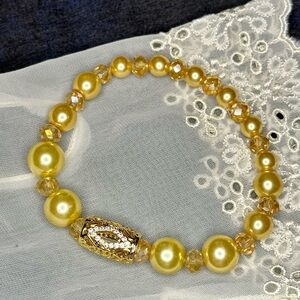 Custom made faux pearl and crystal evil eye bracelet